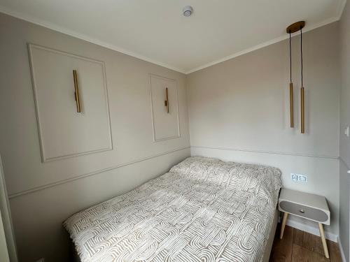 Ένα ή περισσότερα κρεβάτια σε δωμάτιο στο Apartament KAJA