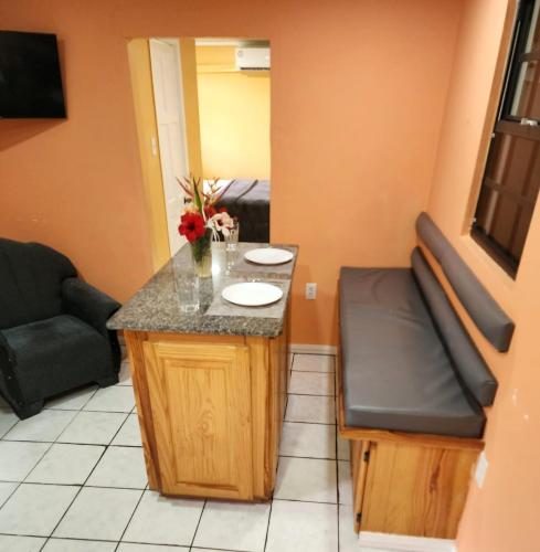 a small room with a counter and a couch at Ideal Executive Suites in Georgetown