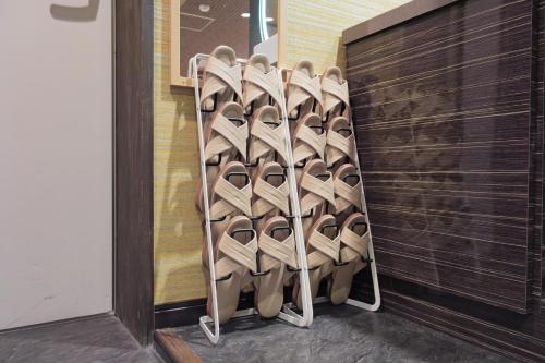 a bunch of shoes are lined up against a wall at Disney Style Hotel "J Hotel" - Vacation STAY 17216v in Chiba