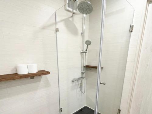 a shower with a glass door in a bathroom at Vamos Villa Tokunoshima - Vacation STAY 19370v in San