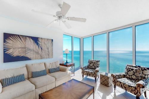 a living room with a couch and two chairs at Palazzo 1401 in Panama City Beach