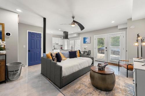 a living room with a couch and a table at The Rhitreat, Studio, 10 Min Downtown & Airport in Atlanta