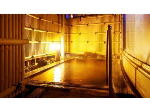 an empty room with a wooden floor in a building at Hotel Symphony - Vacation STAY 85392v in Sagae