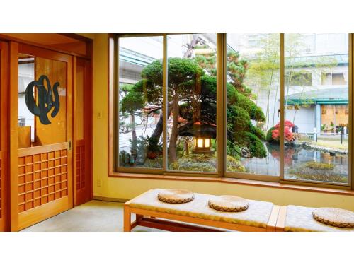 a room with a large window with a tree outside at Hotel Symphony - Vacation STAY 85394v in Sagae