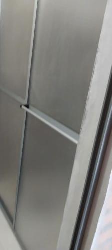 a close up of a refrigerator with a glass door at Villa Fernandito in Fernando de la Mora