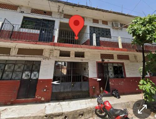 a building with a red pin in front of it at Recamara Alan en Zona Romantica Departamento compartido con el host in Puerto Vallarta
