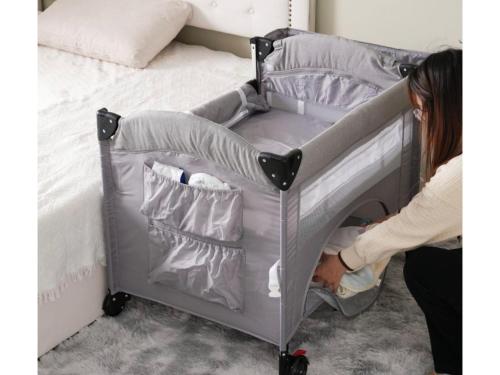 a woman is standing next to a bed at Peace Inn Hagi - Vacation STAY 92117v in Hagi