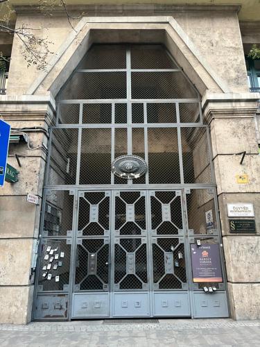 a large metal door on a building at Karoly Corner Residences in Budapest
