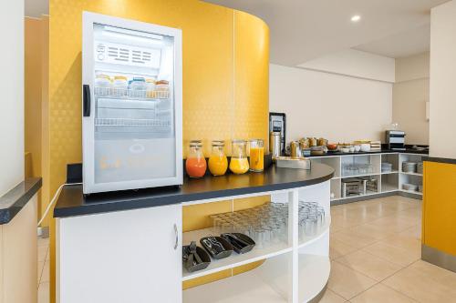a kitchen with an open refrigerator with drinks at Fueguino Hotel in Ushuaia