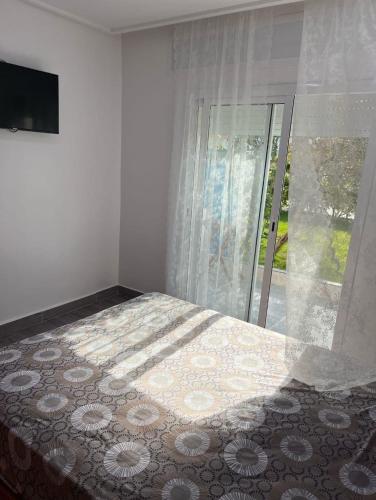 Cama ou camas em um quarto em Almina plage