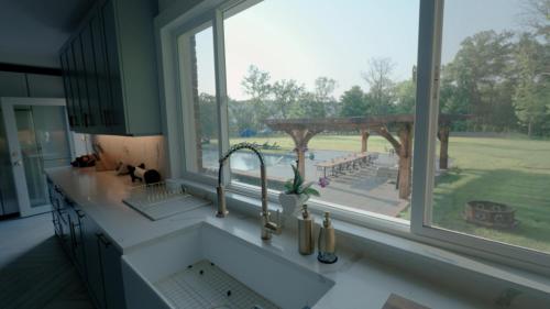 a kitchen with a window with a view of a park at Carpathia West Estate in West Milford