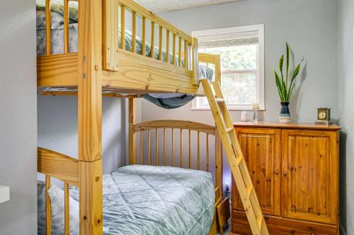 a bunk bed with a ladder in a room at Riverfront Duplex Dock and Views in Nine Mile Falls in Nine Mile Falls