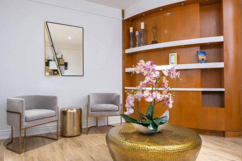 a vase of flowers on a table in a room at Marriott St. Kitts Beach Club in Frigate Bay