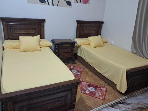 Postel nebo postele na pokoji v ubytování Al Sharif Hotel Apartments