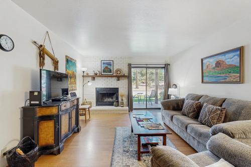 a living room with a couch and a fireplace at Sedona Sky Sanctuary in Sedona