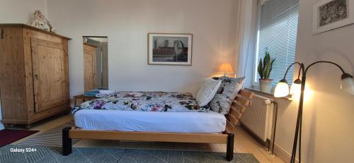 Ένα ή περισσότερα κρεβάτια σε δωμάτιο στο Schoenes helles Zimmer mit Bad, Nähe Bilk, Nähe Uni