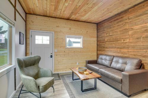 a living room with a couch and a chair at Near Twilight Sites and Scenic Hikes Forks Apt in Forks