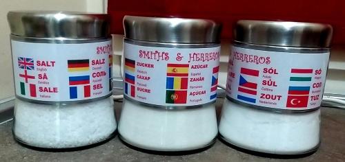 three containers of white flour sitting on a counter at Smiths & Herreros in Genova