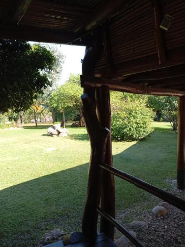 a view of a park from the inside of a porch at Posada de Nono in Nono