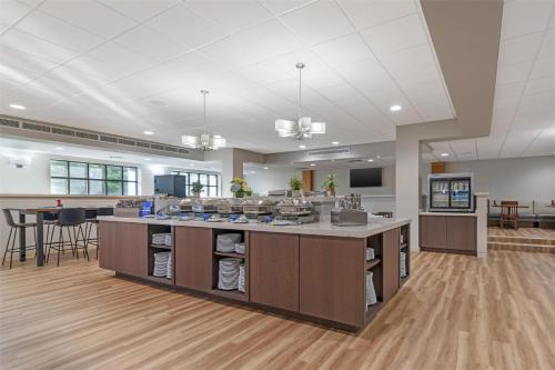 a large room with a kitchen with a counter top at Best Western Royal Plaza Hotel and Trade Center in Marlborough