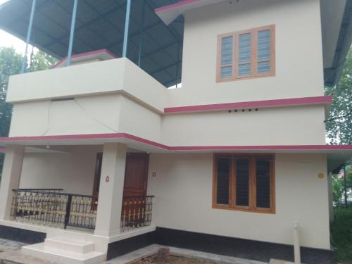a house with a facade of white at BITRA home stay in Varkala