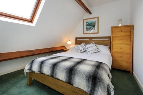 En eller flere senge i et værelse på Tonnau