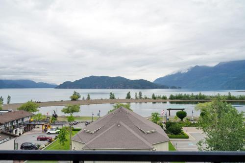 a view of the lake from the balcony of a resort at 1BR Lakeside Getaway on Harrison Lake in Harrison Hot Springs