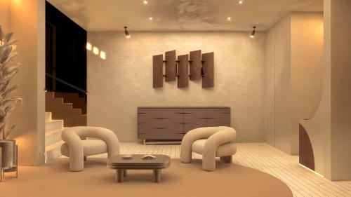 a living room with a chair and a ottoman at Casa Tasman in Mexico City