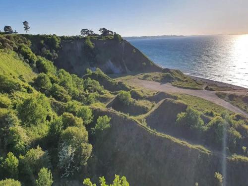 an aerial view of a cliff next to the ocean at 6 person holiday home in Nykøbing Sj-By Traum in Klint