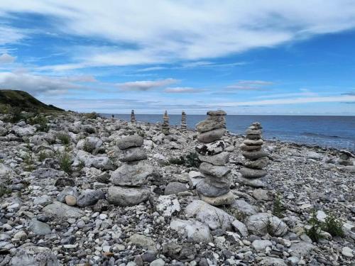 a stack of rocks sitting on a rocky beach at 6 person holiday home in Nykøbing Sj-By Traum in Klint