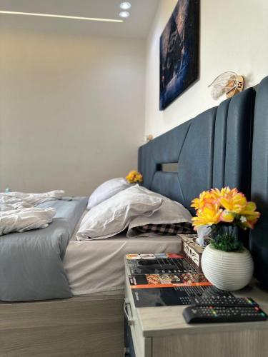 a bedroom with a bed and a desk with a keyboard at king pyramids in Cairo