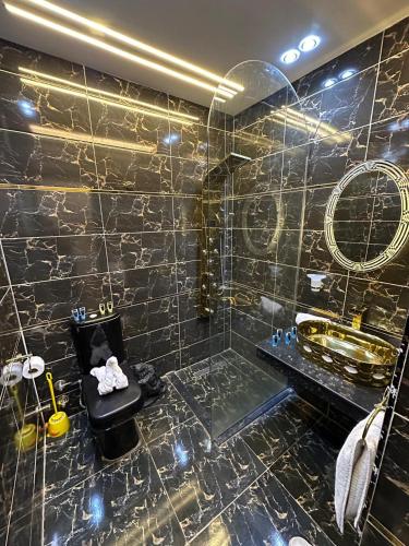a bathroom with a tub and a sink and a shower at king pyramids in Cairo