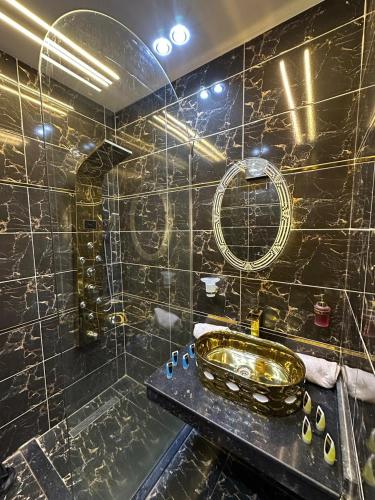 a bathroom with a sink and a mirror at king pyramids in Cairo