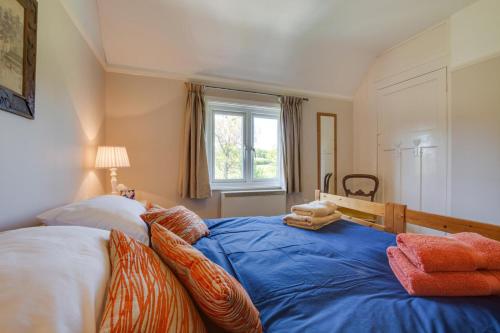 Ένα ή περισσότερα κρεβάτια σε δωμάτιο στο Penhill Cottage