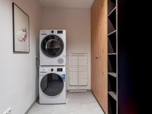 a washer and dryer in a small room at Chalet Kolibri in Sankt Lambrecht