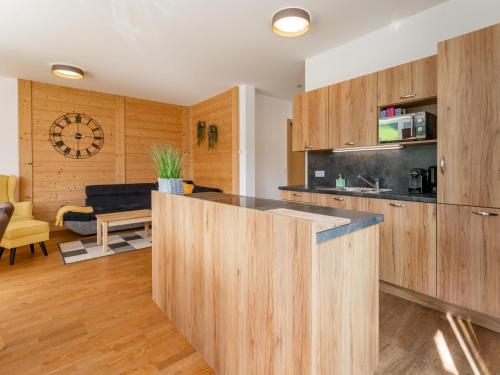a kitchen with wooden cabinets and a counter top at Pabstin in Sankt Lambrecht