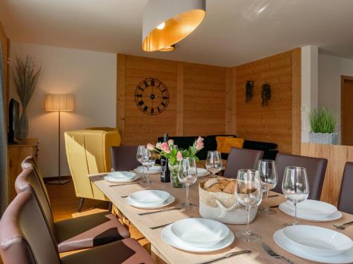 a dining room with a wooden table with wine glasses at Pabstin in Sankt Lambrecht