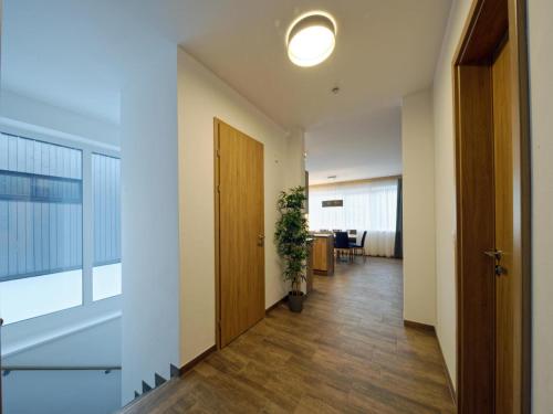 an empty hallway with a door and a potted plant at Winzerchalet in Sankt Lambrecht