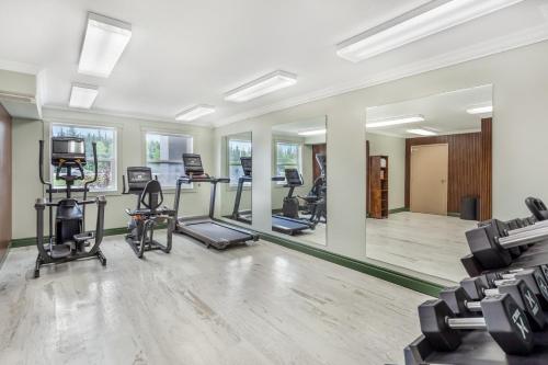 an empty gym with treadmills and elliptical machines at Velora Hinton, an Ascend Collection Hotel in Hinton