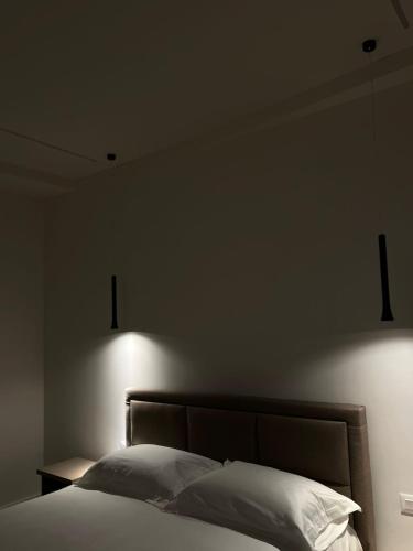 Ένα ή περισσότερα κρεβάτια σε δωμάτιο στο Hotel Gramozi