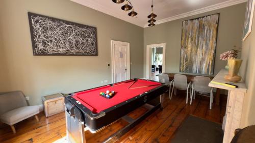 a room with a pool table and a dining room at Manchesters Ultimate House - Hot tub - Sleeps 23! in Manchester