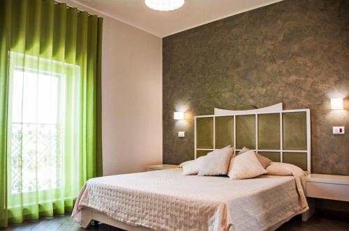 Posteľ alebo postele v izbe v ubytovaní B&B Ghalà