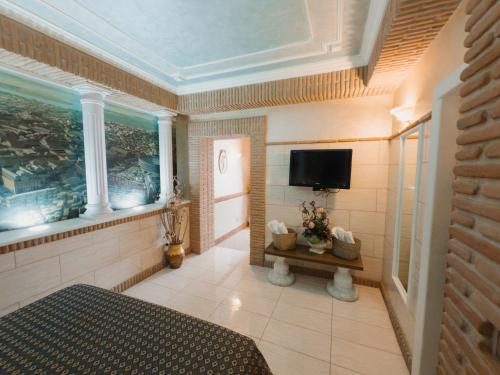 a large room with a television and a room with at Il Castello di Perano in Perano
