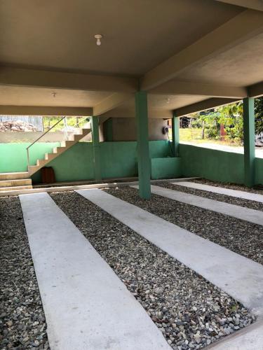 a underside of a bridge with stairs and gravel under it at apartamento cerca de aguas termales in Gracias