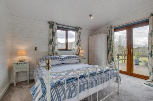 Ένα ή περισσότερα κρεβάτια σε δωμάτιο στο The Lodge