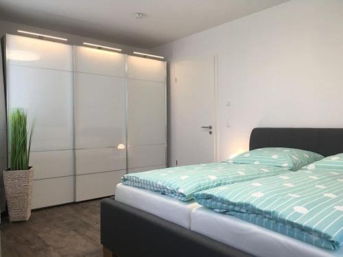 Katil atau katil-katil dalam bilik di Holiday apartment STRELASUNDBLICK