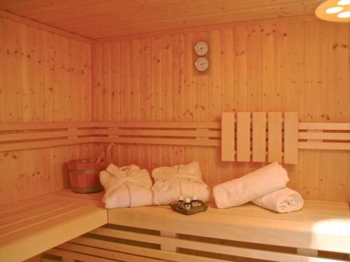 a room with a row of towels in a sauna at Holiday home with 2 bedrooms in Göhren-Lebbin