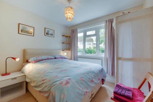 a bedroom with a bed and a window at Middleton View in Ilkley