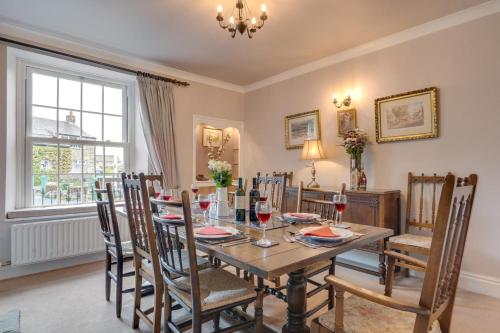 a dining room with a table and chairs at Littlebeck in Kettlewell