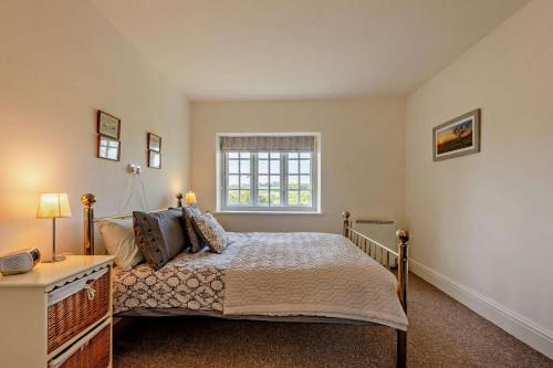 En eller flere senge i et værelse på Toad Hall